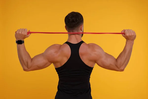 depositphotos 680379752 stock photo young man exercising elastic resistance